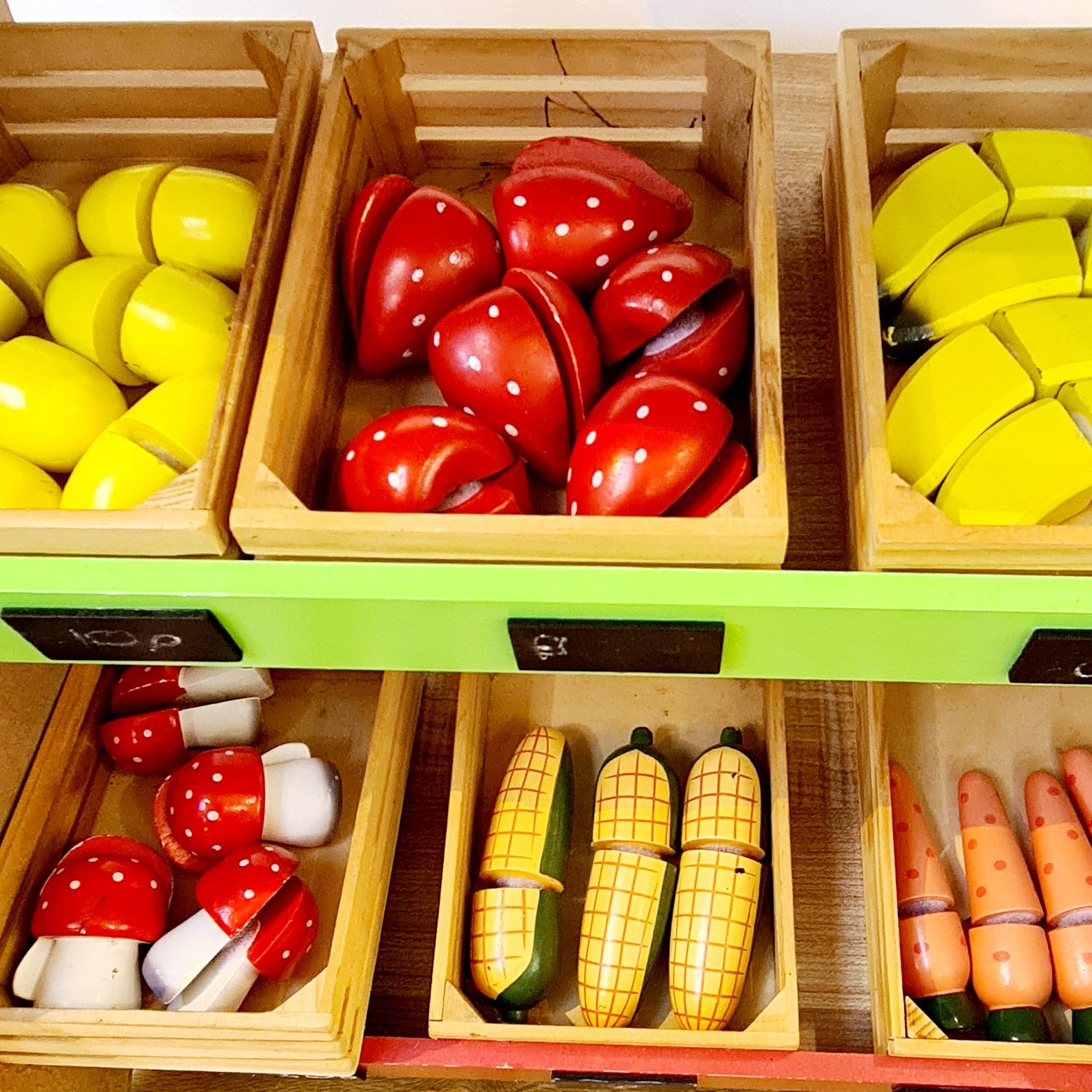 fruit and vegetables wooden toys in playroom
